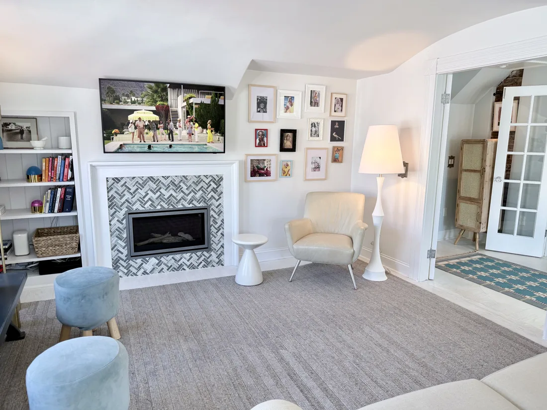 Living room fireplace, art wall and reading chair at Ptown Perch