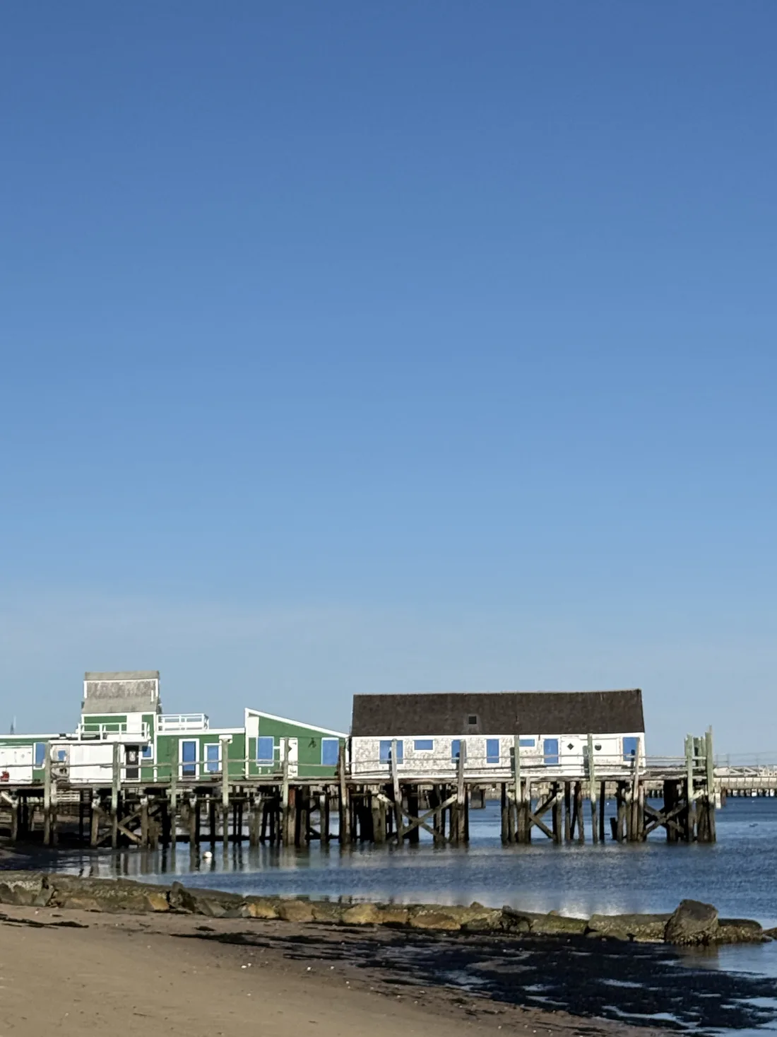 MacMillan Pier and the Provincetown waterfront beneath a clear blue sky